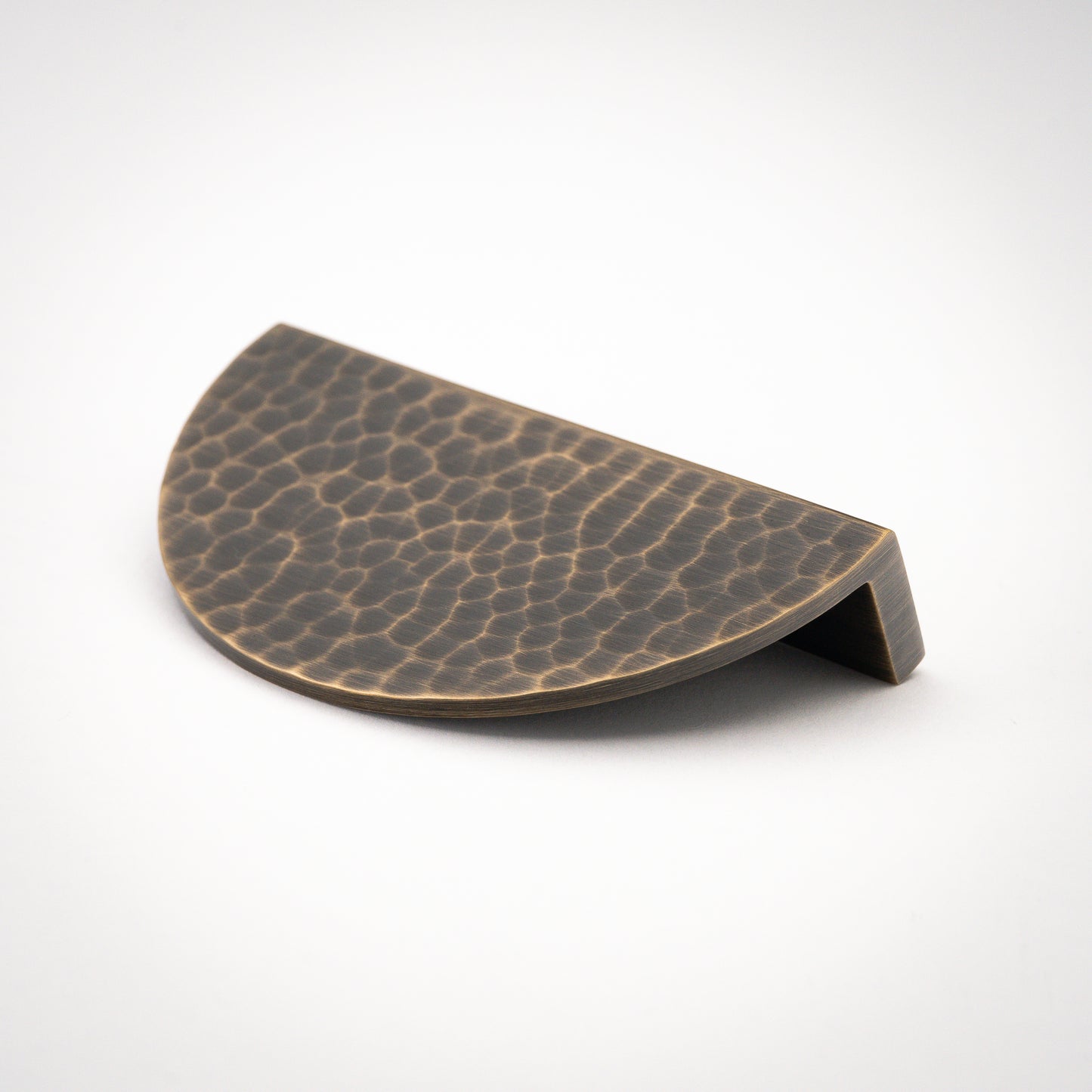 Hammered Demi Lune, Solid Brass Half Moon Cabinet PullsThis Demi Lune Hammered Pull is crafted from solid brass and finished with a unique hammered texture. With its half-moon shape, it's a charming addition to any kitchpullHammered Demi Lune, Solid Brass Half Moon Pulls