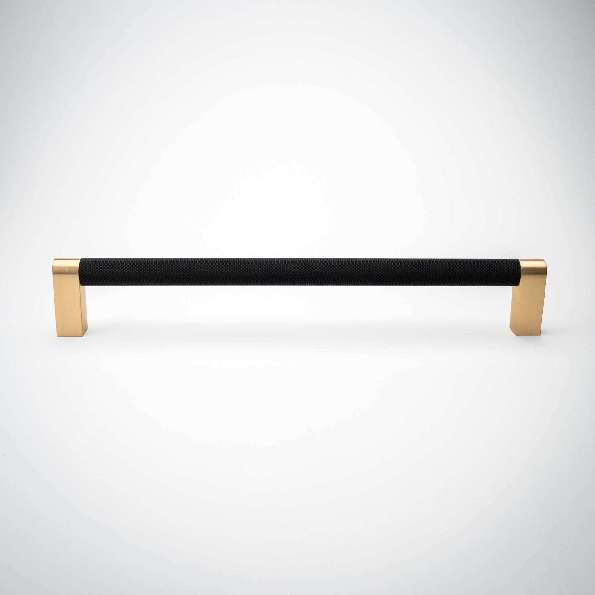 Bold, Black & Gold Knurled Cabinet Pulls Go BOLD in your home!Our Bold, Black and "gold" cabinet pull brings a modern feel to your cabinetry. Its two-toned style is visually fresh, while its knurled matpullBold, Black & Gold Knurled Solid Brass Cabinet Pulls