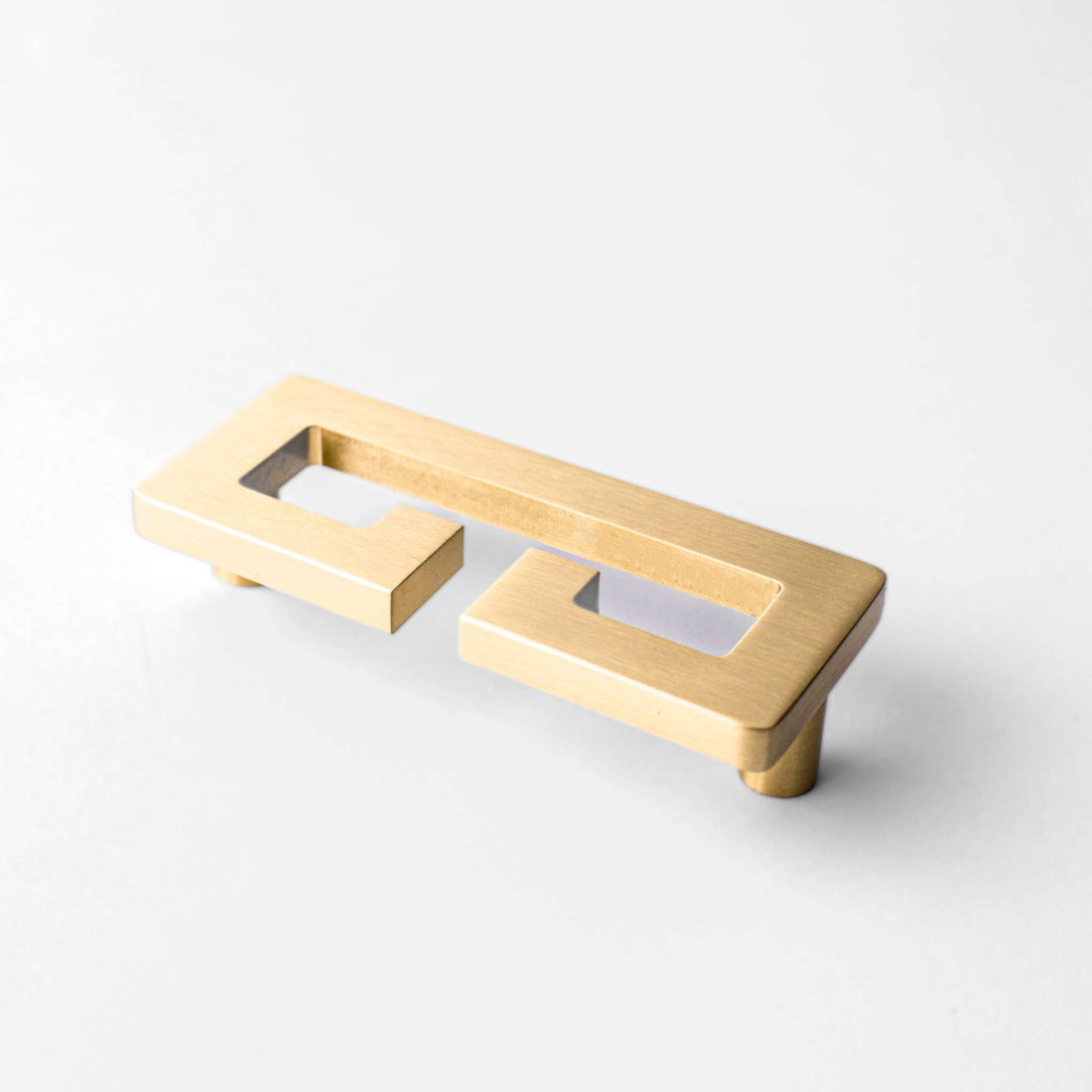 Chloe Greek Key cabinet pull shown at a shallow angle