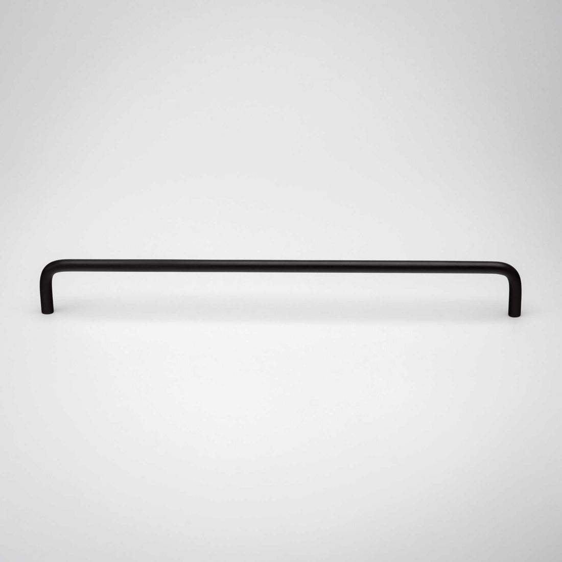 Front view of a long black Arch cabinet pull