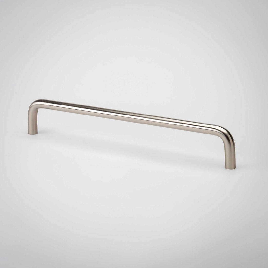 Arch cabinet pull showing its continuous bent-bar form