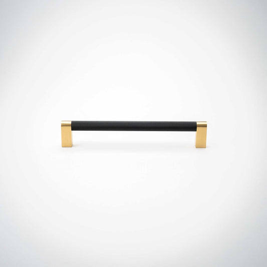 Bold cabinet pull showing its two brass mounting feet