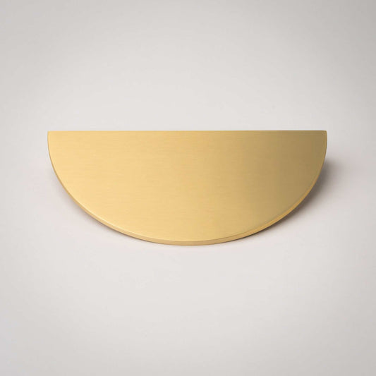 Front view of a Demi Lune pull in Satin Brass with matte lacquer