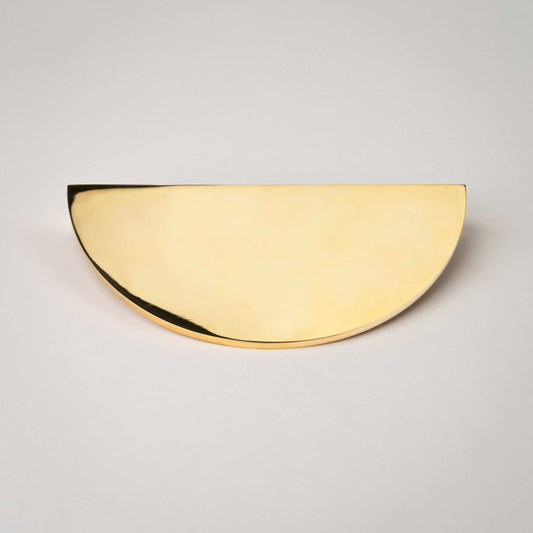 Front view of a new Demi Lune pull in Polished Brass, unlacquered