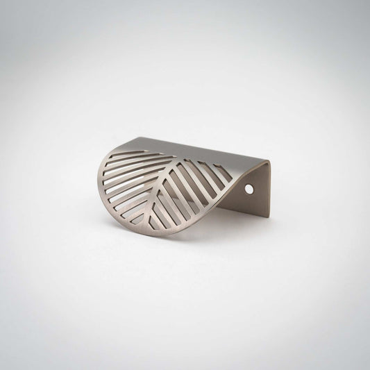 Frond edge pull showing its nickel-colored patterned face
