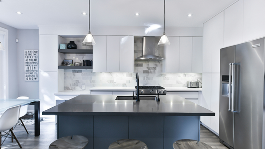 Minimalist Kitchen With White Slabbed Cabinets And Stainless Steel Appliances