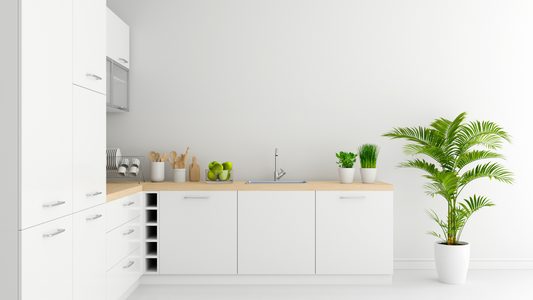 Modern Minimalist Kitchen With White Cabinetry, Light Wood Countertops, Polished Chrome Cabinet Handles