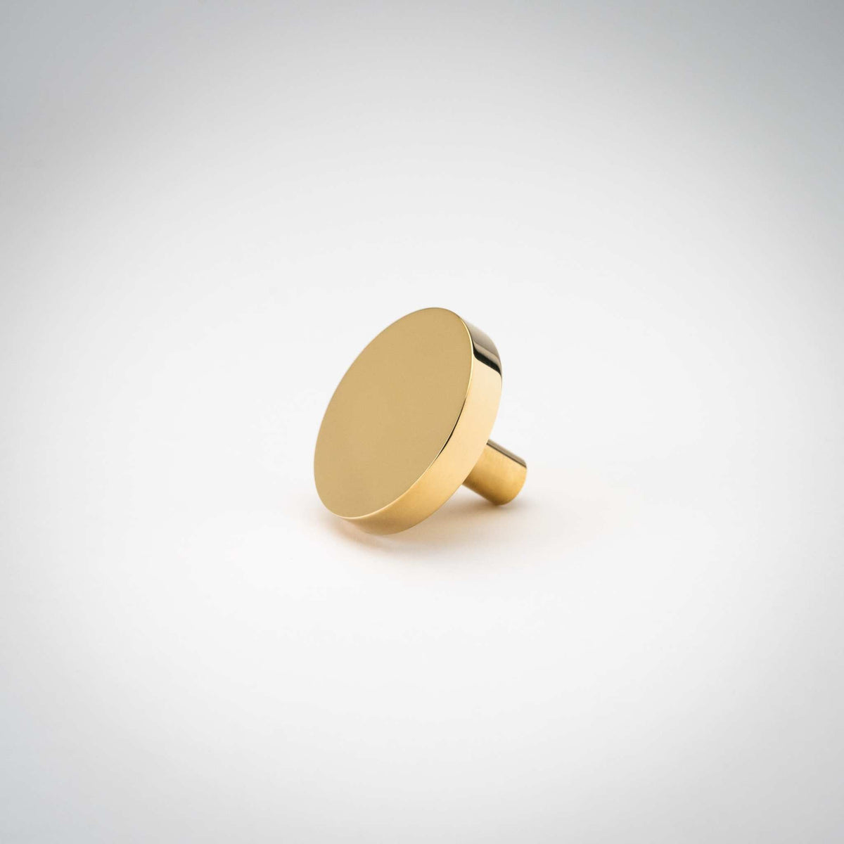 Rondelle knob with a new unlacquered polished brass surface