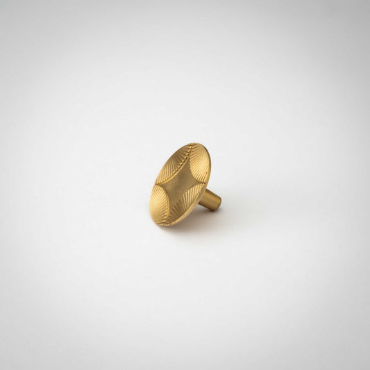 Star cabinet knob tilted to show its stem and patterned face