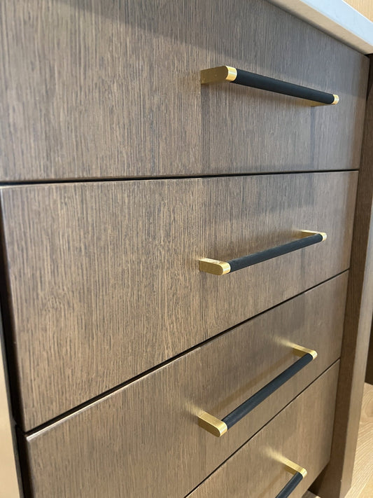 Bold cabinet pulls on wood drawers