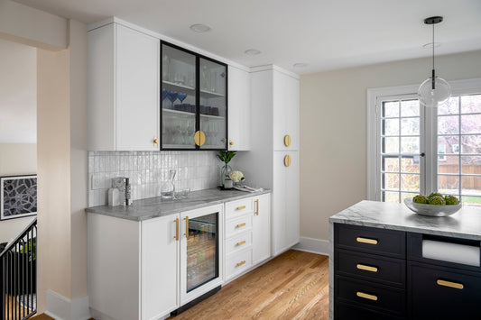 White solid and glass cabinet doors with half-moon and rounded brass pulls