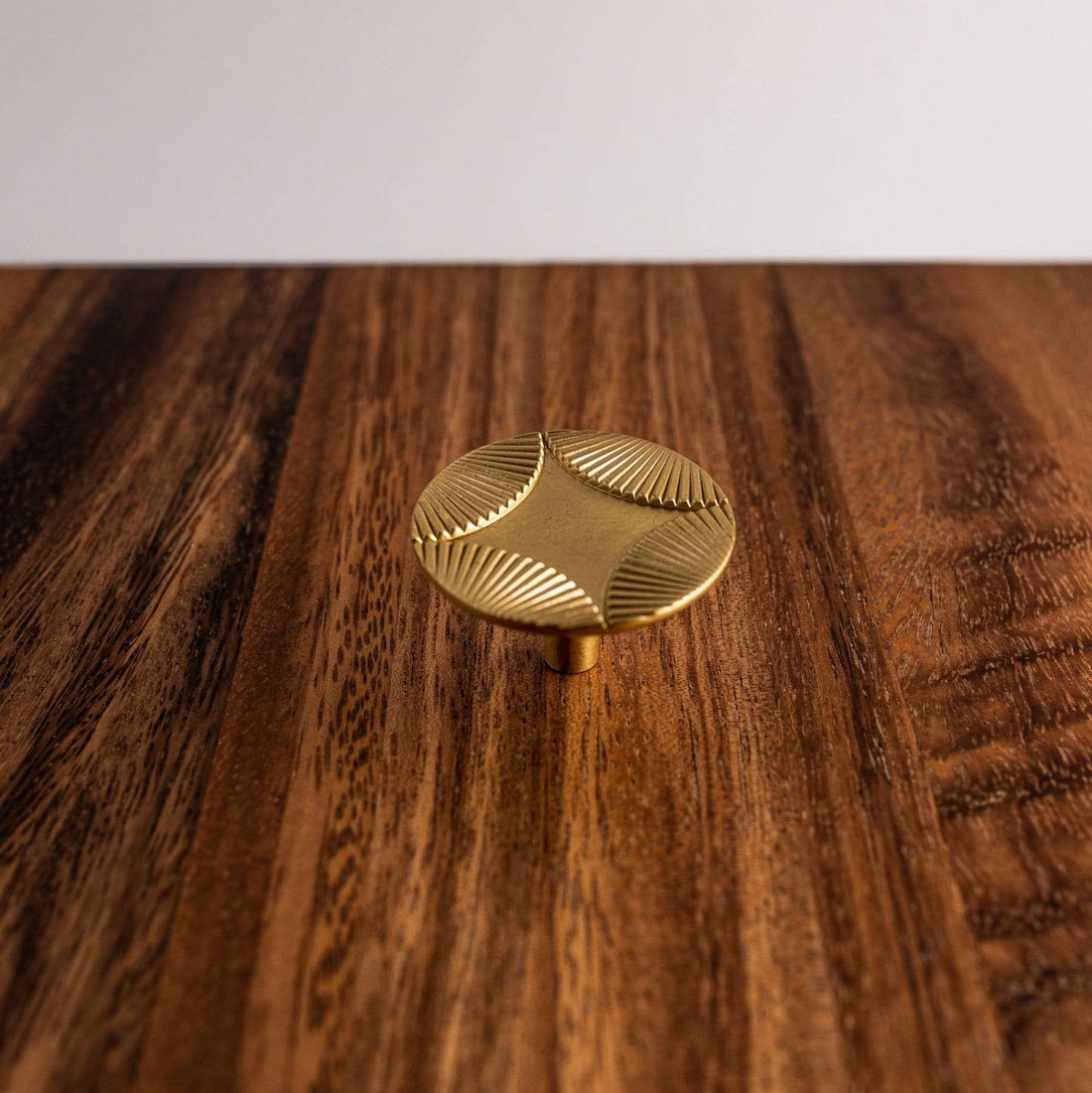 Star cabinet knob on a wood surface