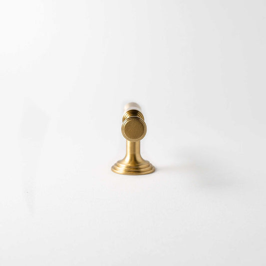 End-on view of a Tuxedo cabinet knob showing the grip, stem and base.