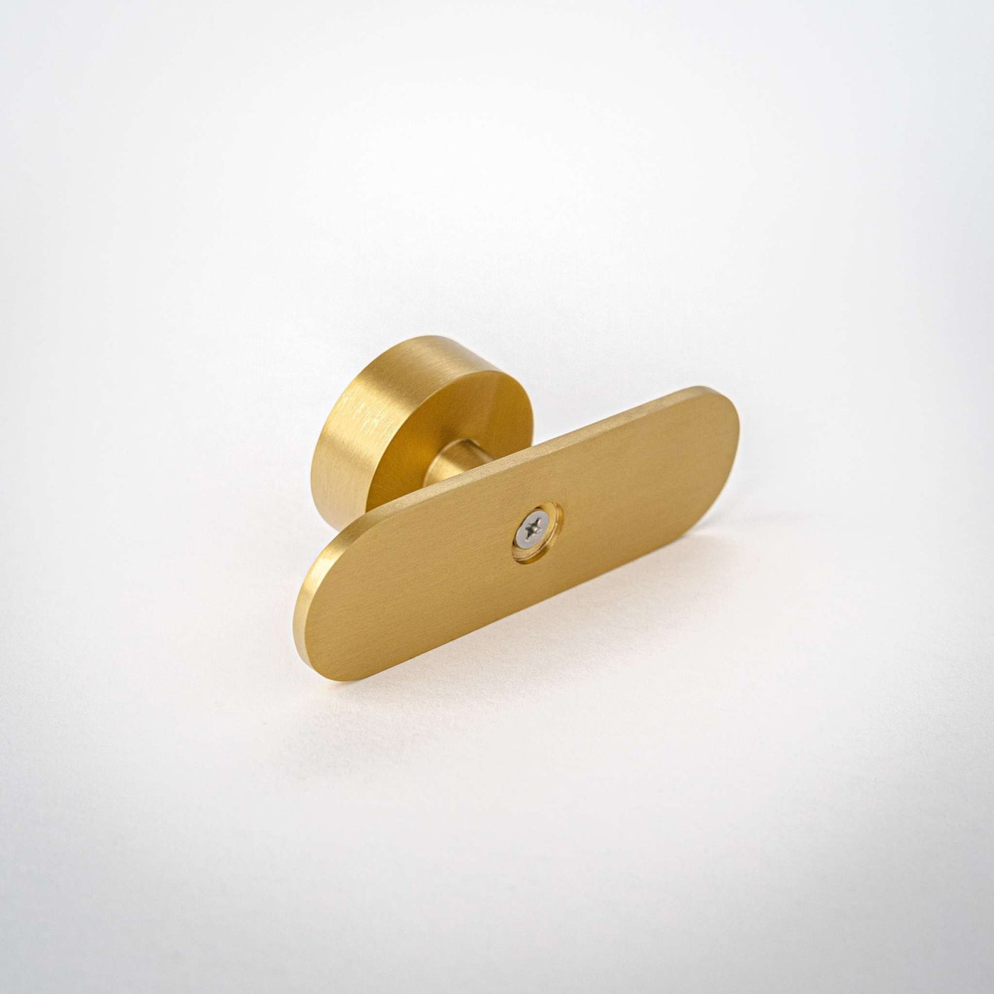 Oblong-shaped knob made of solid brass.