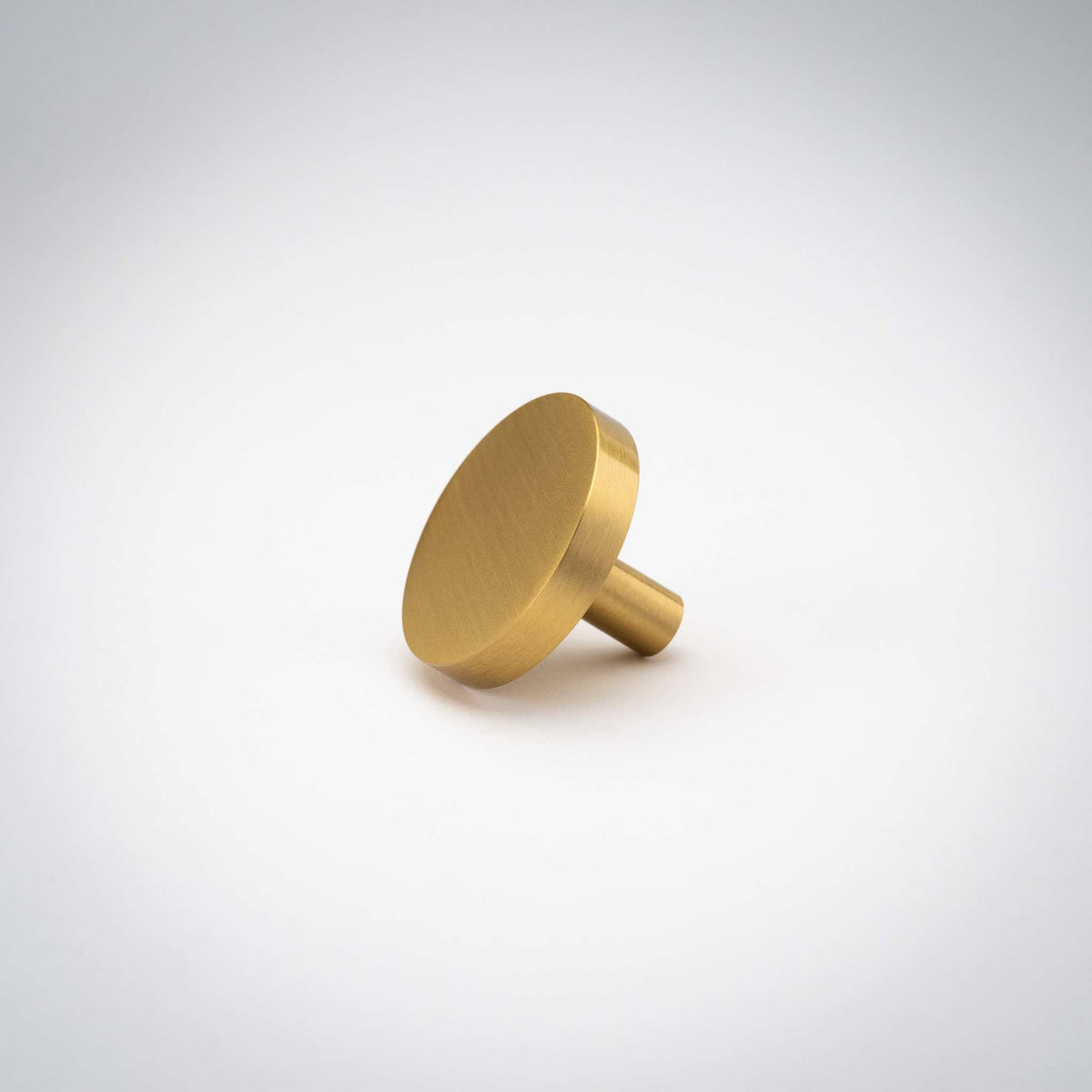 Rondelle Cabinet Knobs, showing round head and short mounting stem.