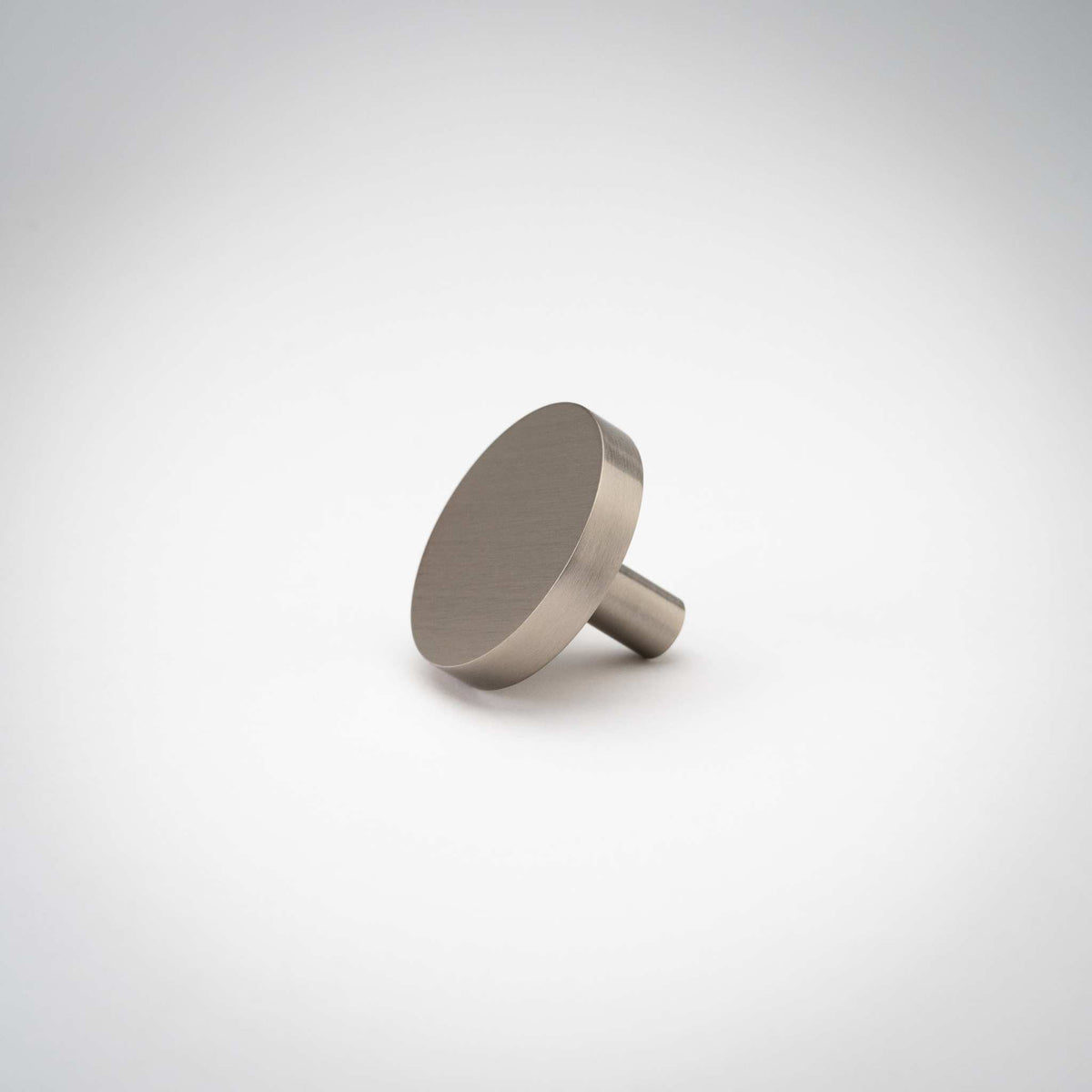 Rondelle Cabinet Knobs, showing round head and short mounting stem.