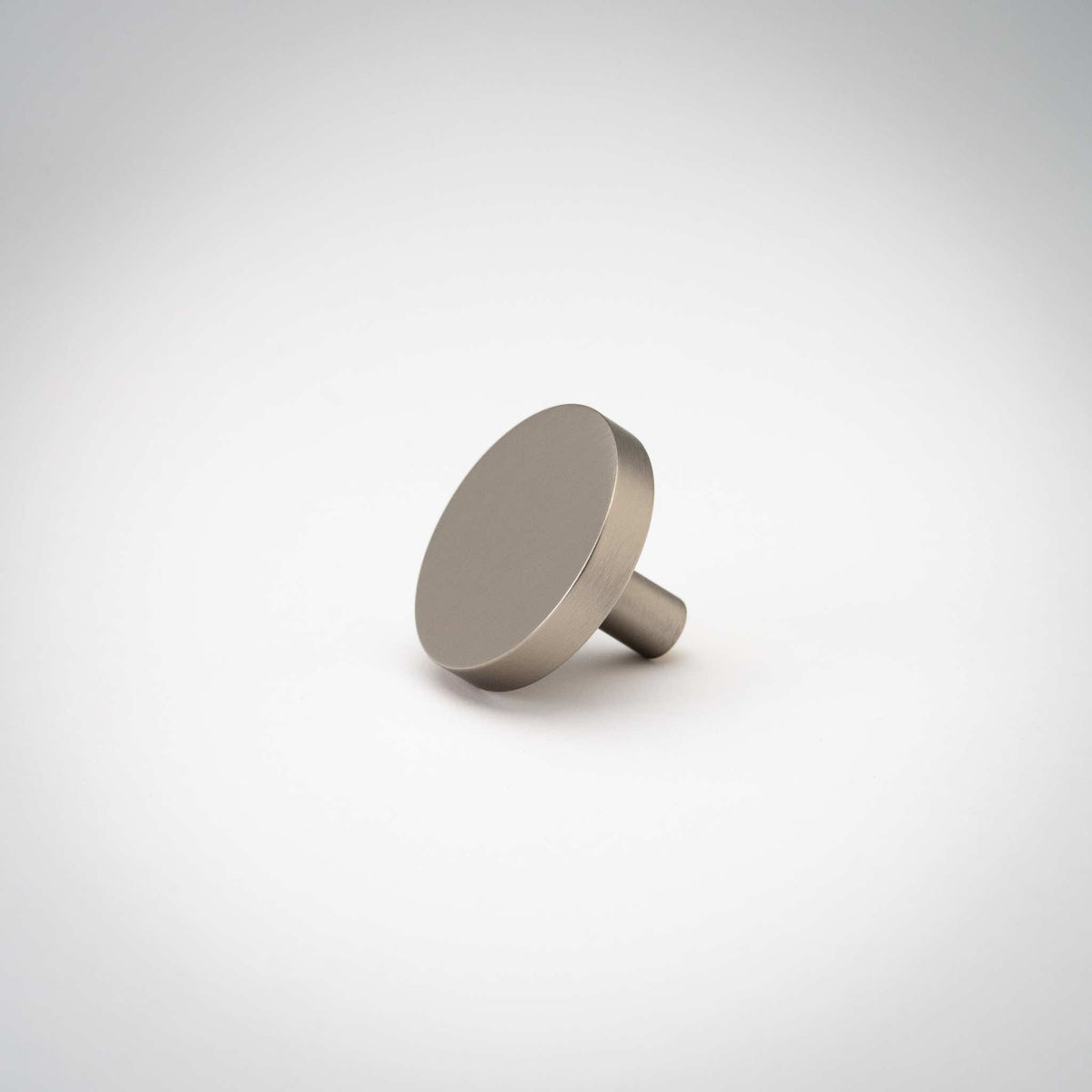 Rondelle Cabinet Knobs, showing round head and short mounting stem.