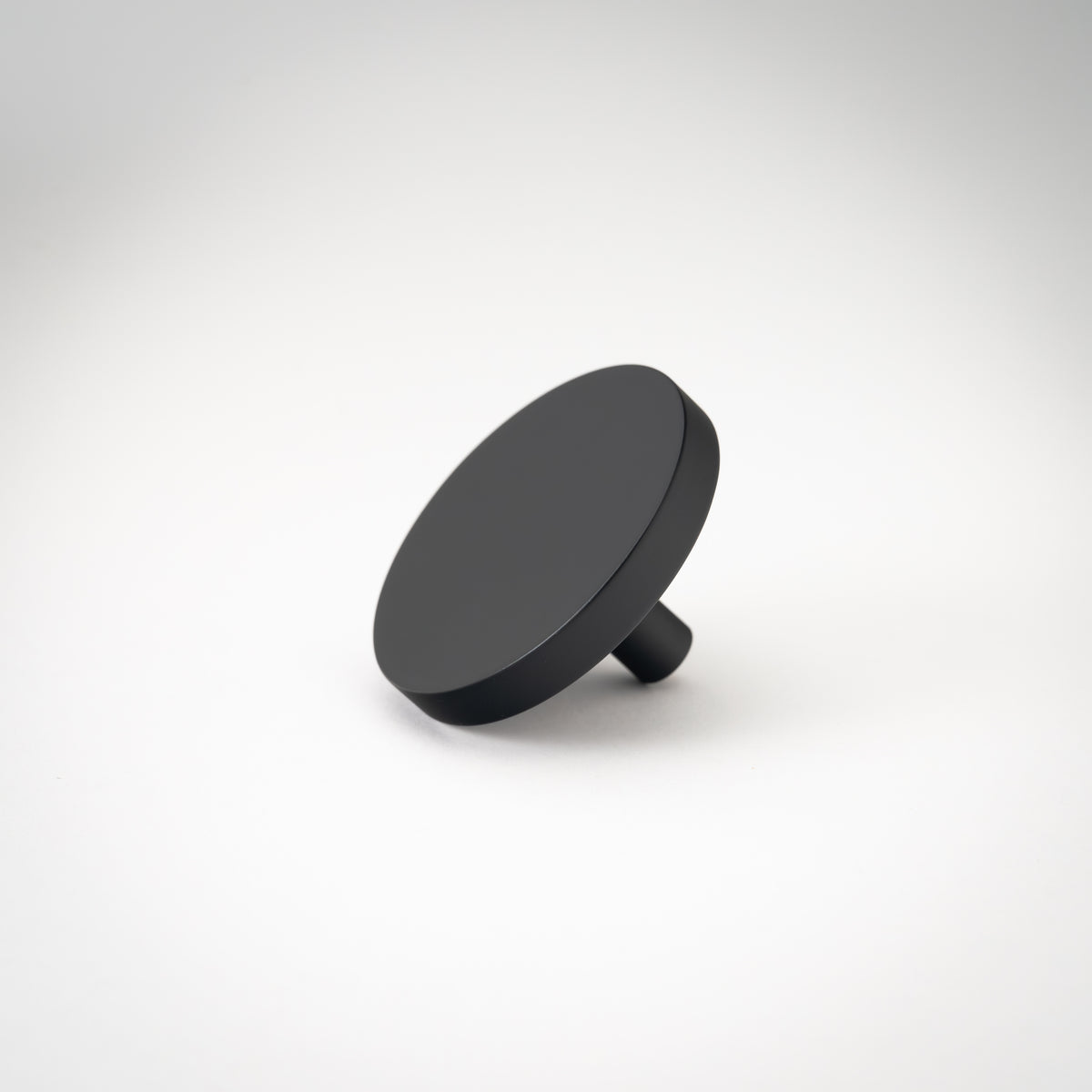 Rondelle Cabinet Knobs, showing round head and short mounting stem.