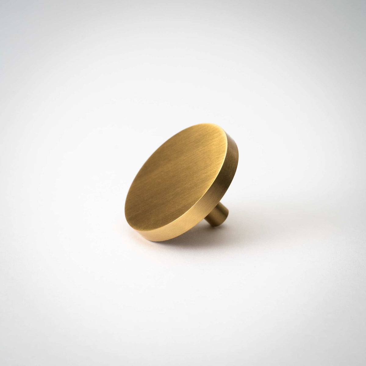 Rondelle Cabinet Knobs, showing round head and short mounting stem.