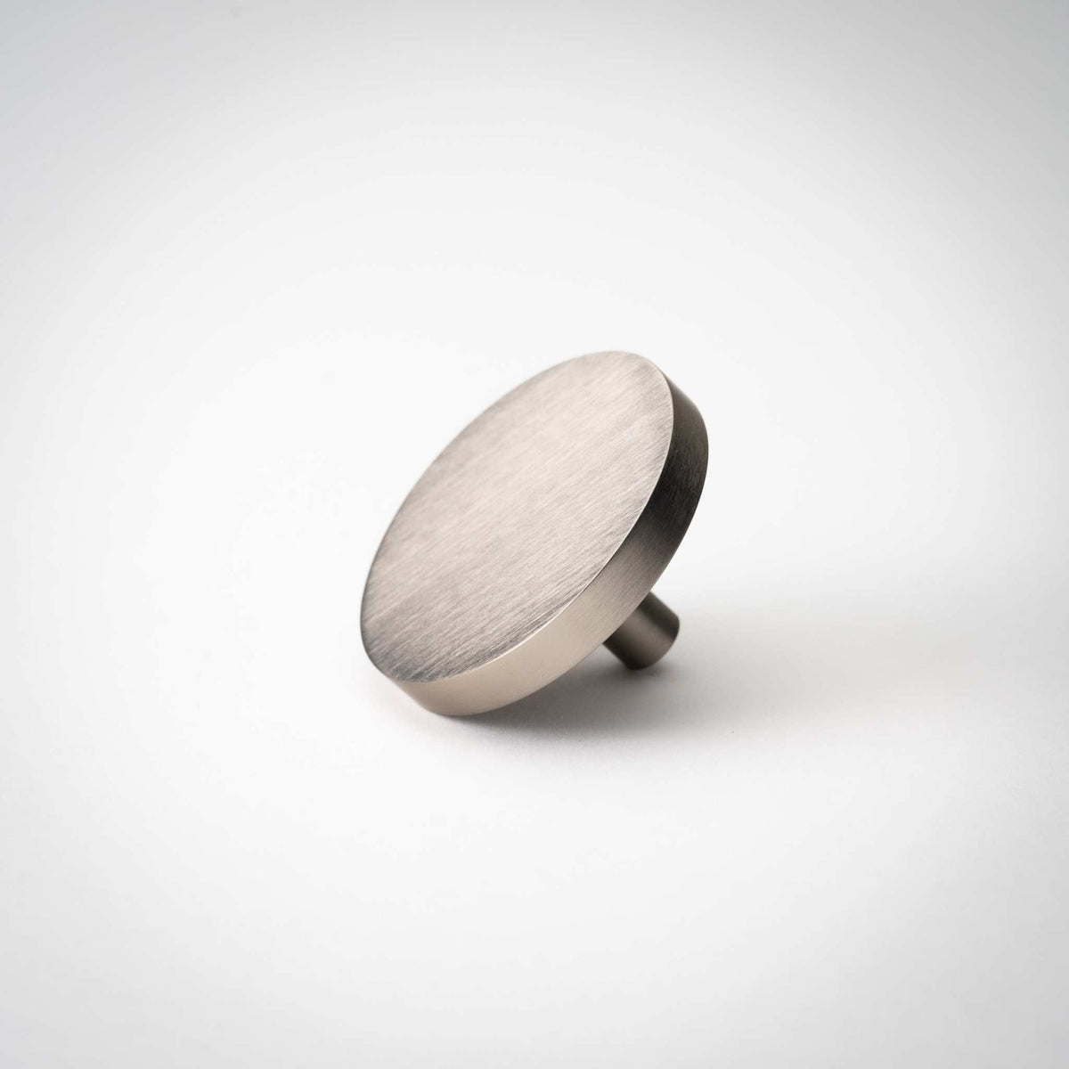 Rondelle Cabinet Knobs, showing round head and short mounting stem.
