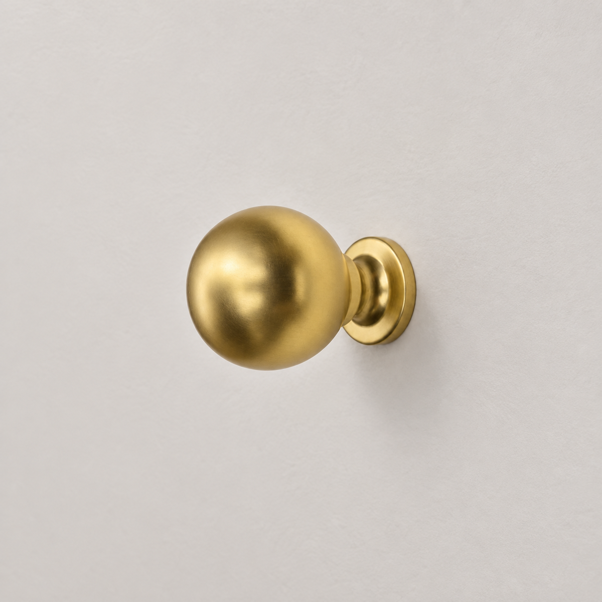 Bishop knob in Satin Brass Matte Lacquer, AI-assisted studio product image