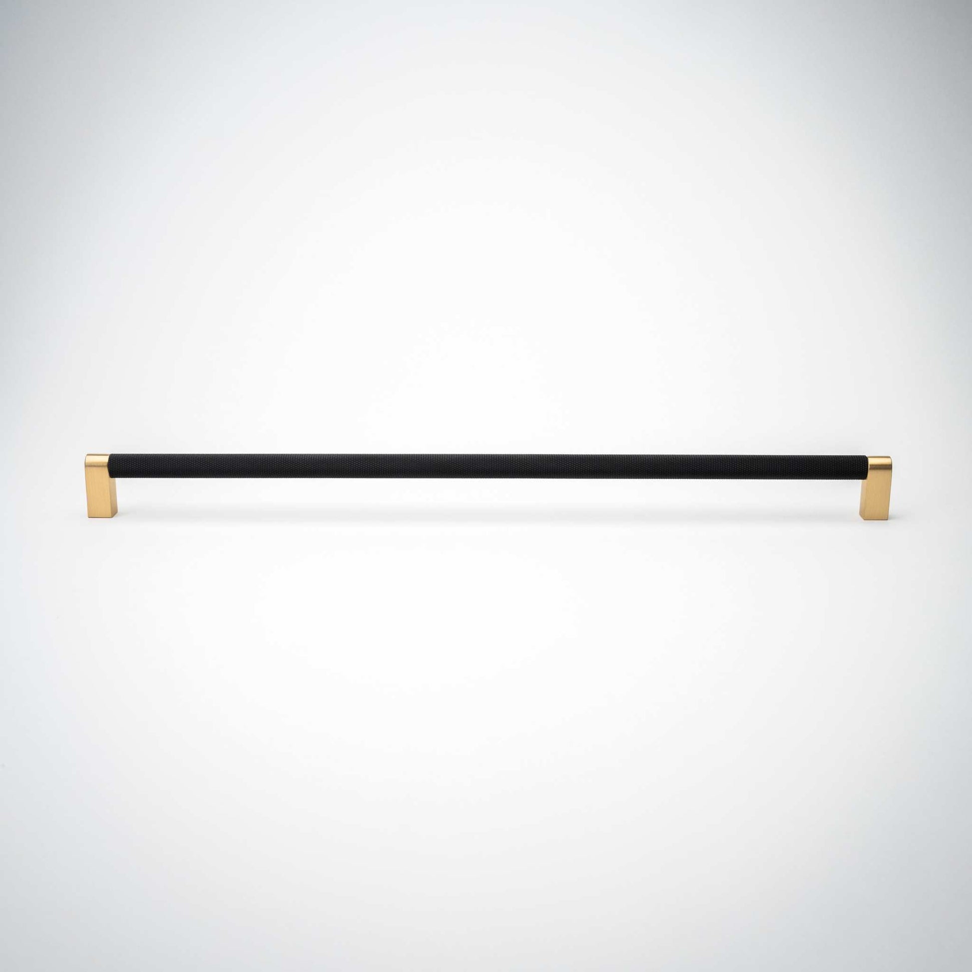Bold, Black & Gold Knurled Cabinet PullsGo BOLD in your home!Our Bold, Black and "gold" cabinet pull brings a modern feel to your cabinetry. Its two-toned style is visually fresh, while its knurled matpullBold, Black & Gold Knurled Solid Brass Cabinet Pulls