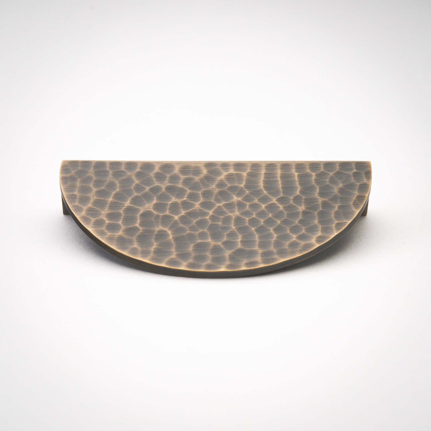 Hammered Demi Lune, Solid Brass Half Moon Cabinet PullsThis Demi Lune Hammered Pull is crafted from solid brass and finished with a unique hammered texture. With its half-moon shape, it's a charming addition to any kitchpullHammered Demi Lune, Solid Brass Half Moon Pulls
