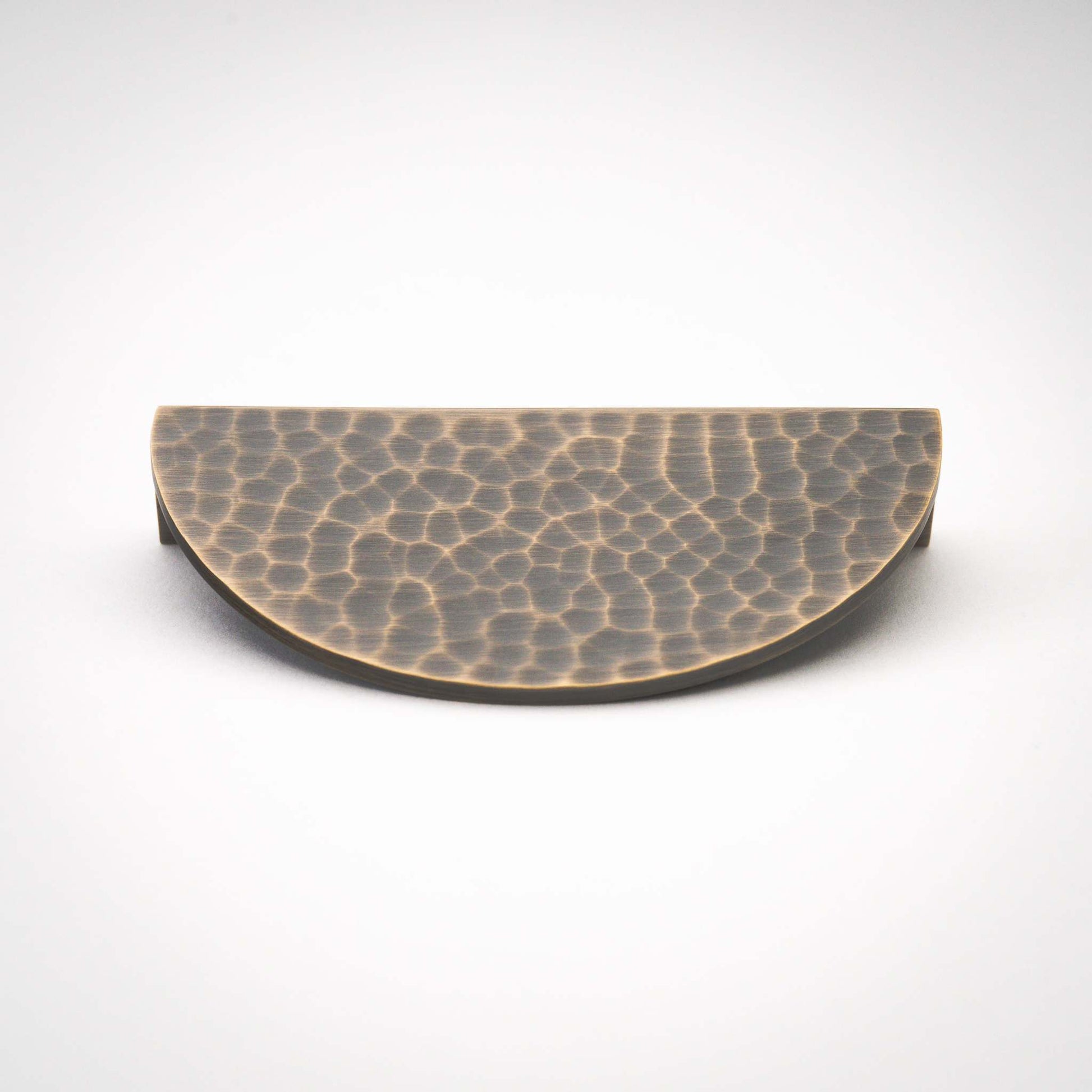 Hammered Demi Lune, Solid Brass Half Moon Cabinet PullsThis Demi Lune Hammered Pull is crafted from solid brass and finished with a unique hammered texture. With its half-moon shape, it's a charming addition to any kitchpullHammered Demi Lune, Solid Brass Half Moon Pulls