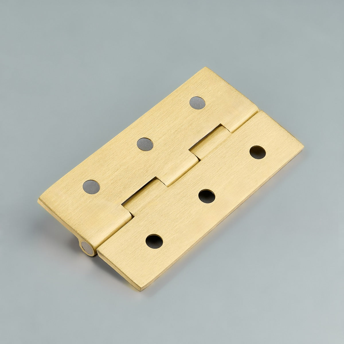 Original satin gold Loki hinge photograph 11; family reference, exact size not assigned