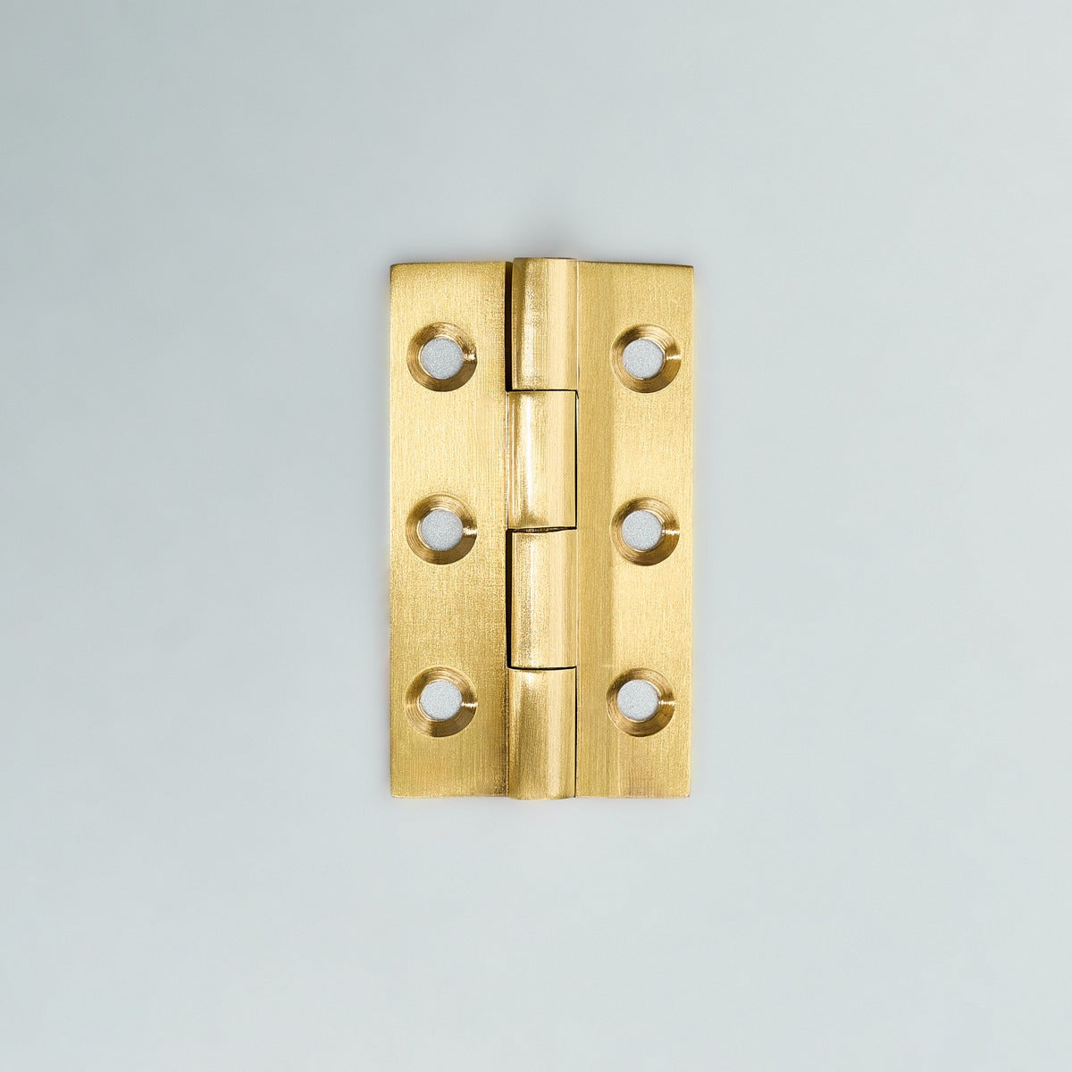 Original satin gold Loki hinge photograph 4; family reference, exact size not assigned