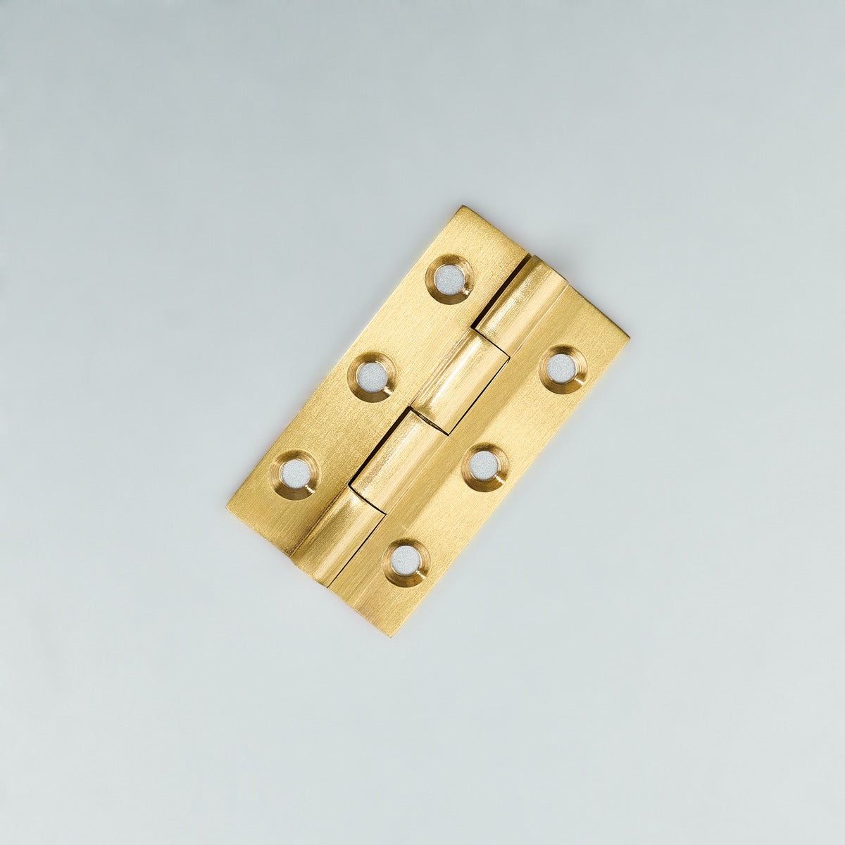 Original satin gold Loki hinge photograph 5; family reference, exact size not assigned