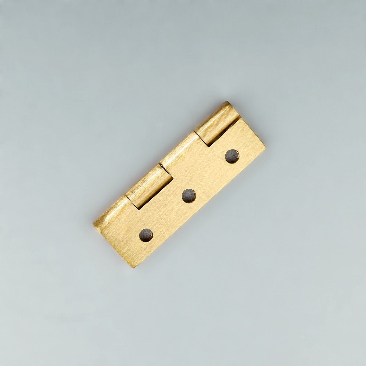 Original satin gold Loki hinge photograph 6; family reference, exact size not assigned