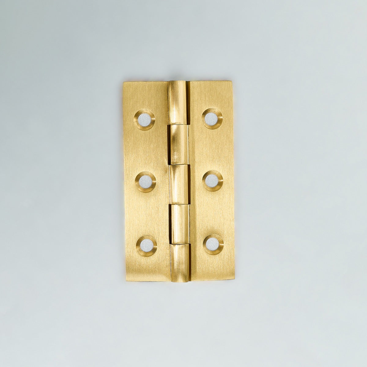Original satin gold Loki hinge photograph 7; family reference, exact size not assigned