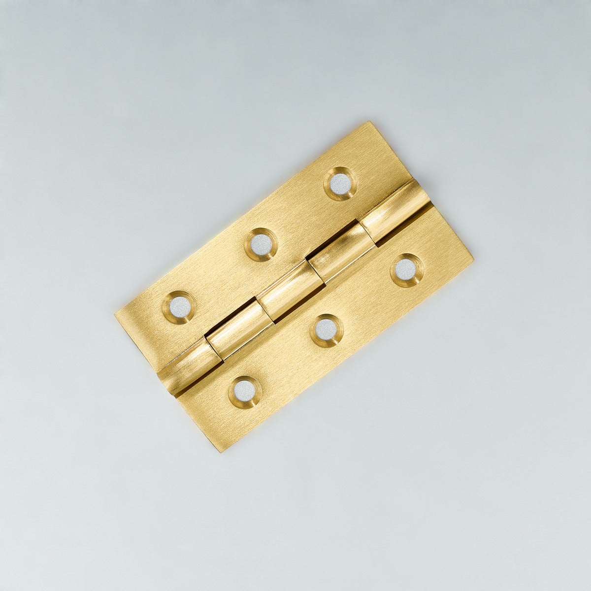 Original satin gold Loki hinge photograph 8; family reference, exact size not assigned